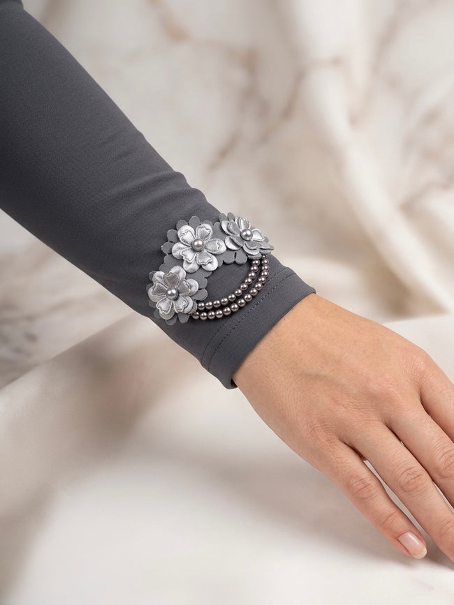 Embellished dark grey arm sleeves with floral appliqué and pearl detailing Hover Image