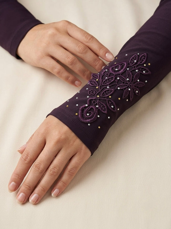 Embroidered plum purple arm sleeves with floral and rhinestone detailing Hover Image